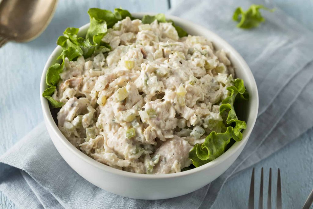 chicken salad in a bowl with lettuce