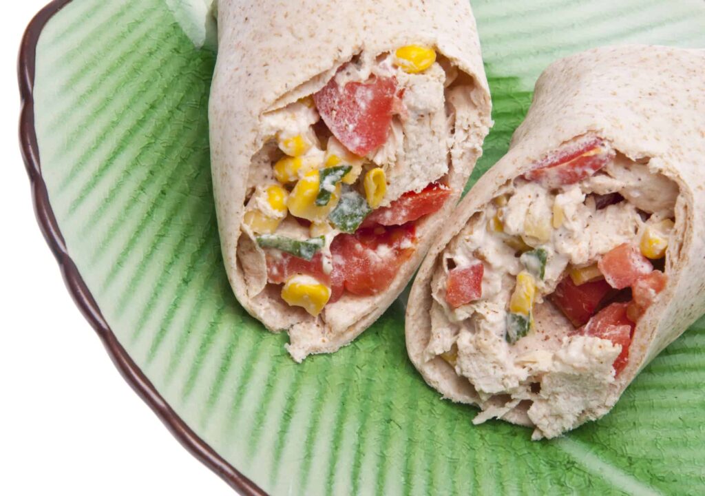 southwestern chicken salad wrap with tomatoes, peppers, and corn
